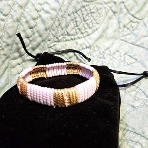 Lavender and gold tone stretch bracelet
